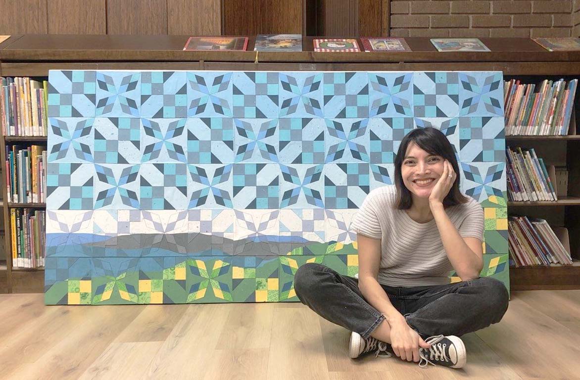 Jade Hoyer in Front of Her Art Piece