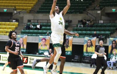 Wonder Boys Basketball Player Going for a Slam Dunk