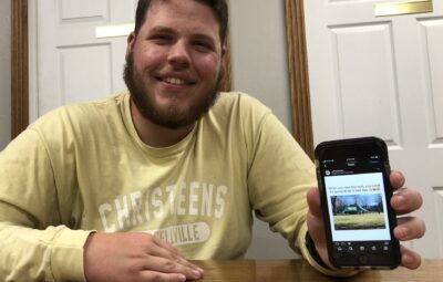 ATU Student Holding His Favorite Meme