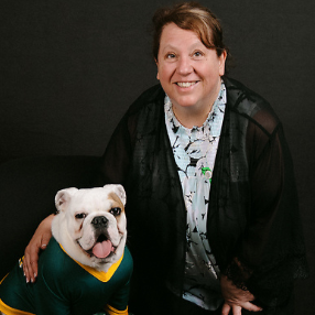 Dr. Kaethe Hoheling poses with Jerry the Bulldog